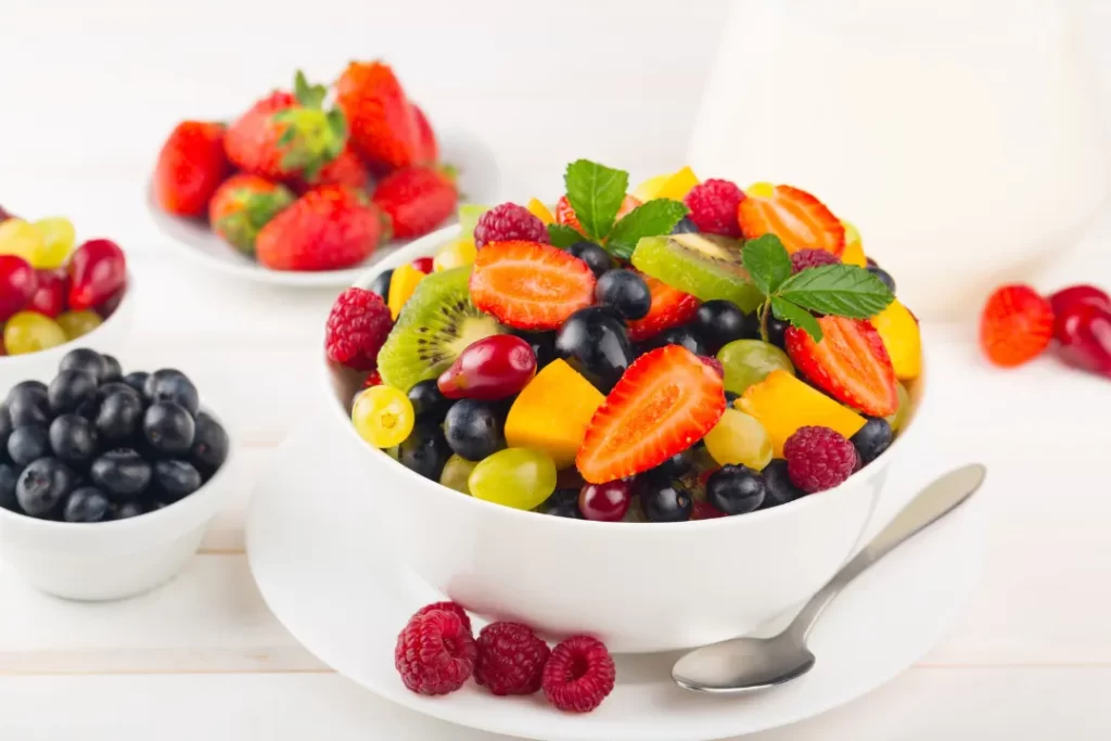 Fresh fruit and berries in  while bowl